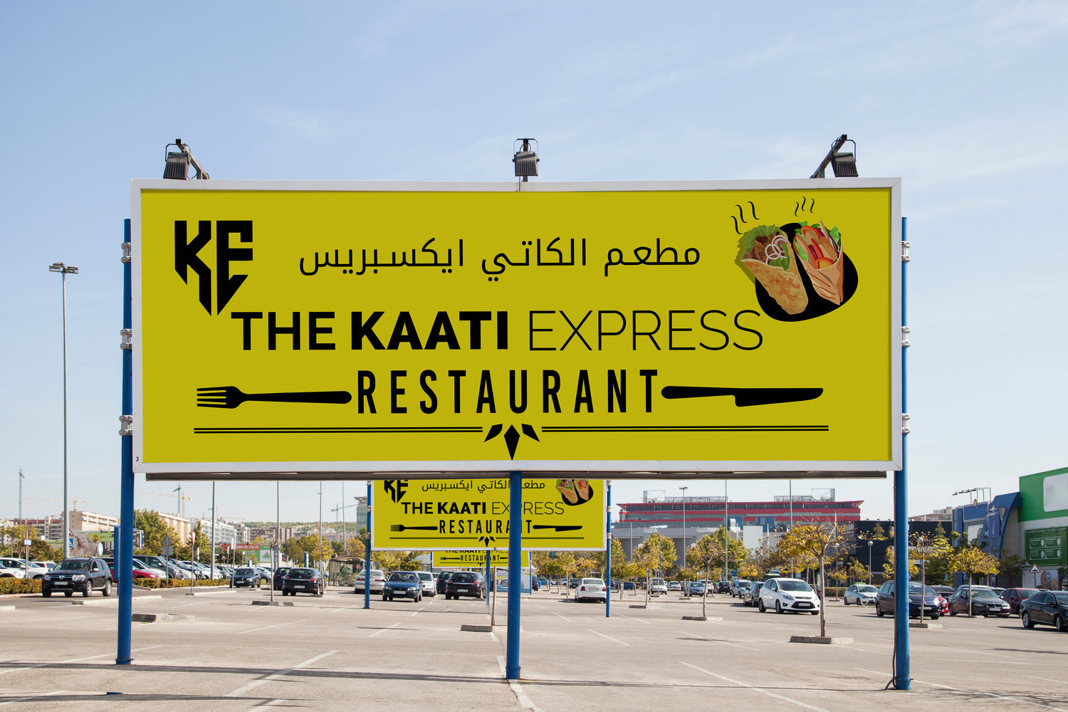 Billboard for The Kaati Express Restaurant in a parking lot with clear sky.